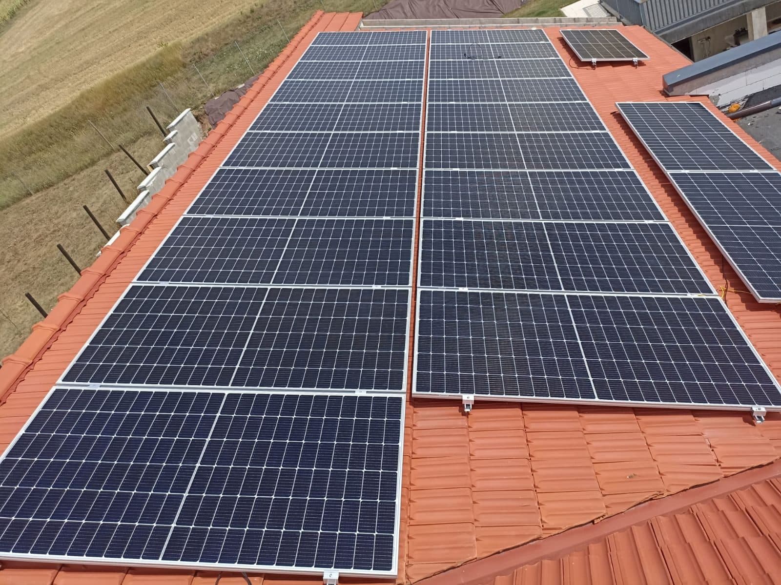 Several rows of solar panels on a roof in Șeușa, Alba